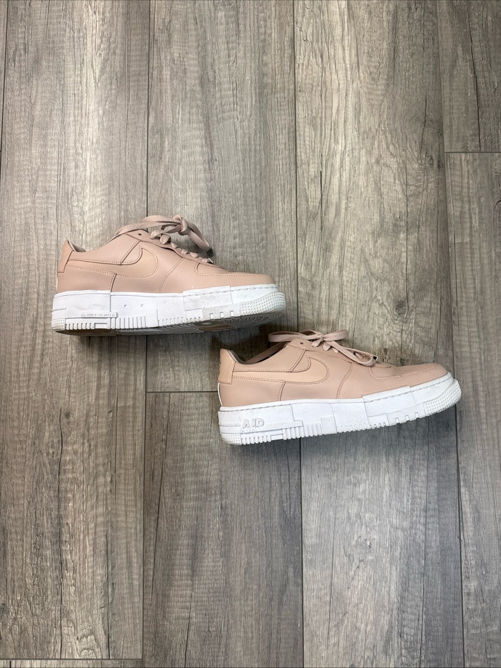 Nike Women's Pale Pink Leather Platform Sneakers